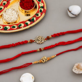Traditional 3 Bhaiya Rakhi Set with Rudraksh beads, Om charms, red moli threads, decorative Kumkum-Chawal thali, greeting card, and chocolate.