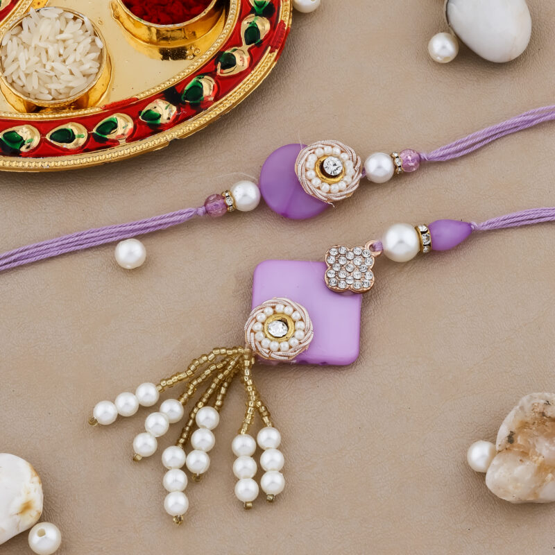 Elegant Bhaiya-Bhabhi Rakhi Combo with Purple Beadwork, Pearl Tassels, Lumba Rakhi, Decorative Thali & Chocolate for Raksha Bandhan