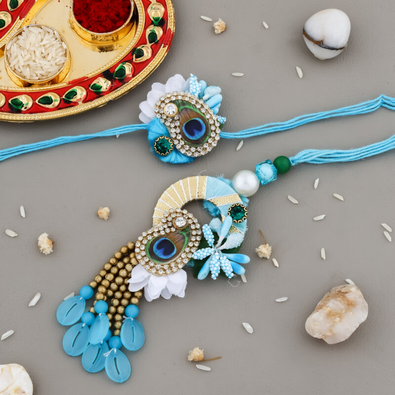 Elegant Bhaiya-Bhabhi Rakhi Combo with Blue Beads, Peacock Feather, Floral Accents, Tassels, Decorative Thali & Chocolate for Raksha Bandhan