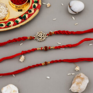 Traditional 3 Bhaiya Rakhi Set with Rudraksh beads, Om charms, red moli threads, decorative Kumkum-Chawal thali, greeting card, and chocolate.